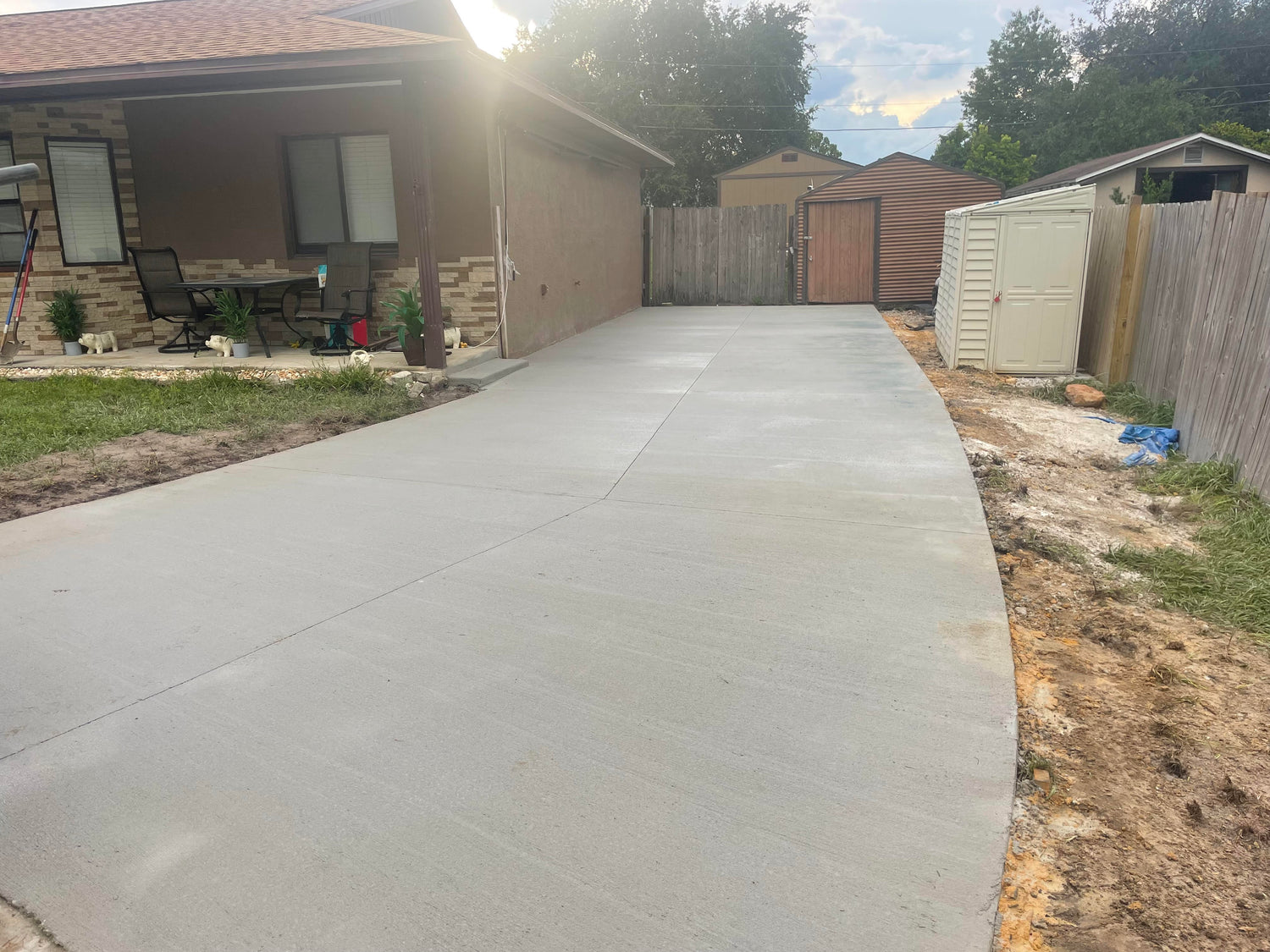 Concrete driveway in DeBary Florida with backyard access