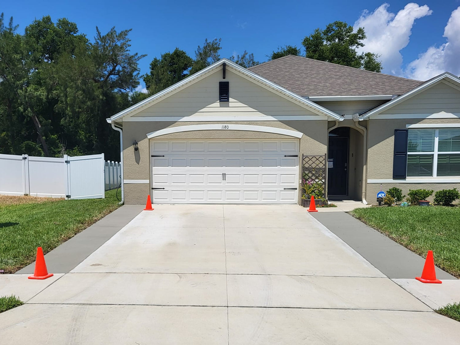 Lake Mary Florida concrete driveway extension with cones