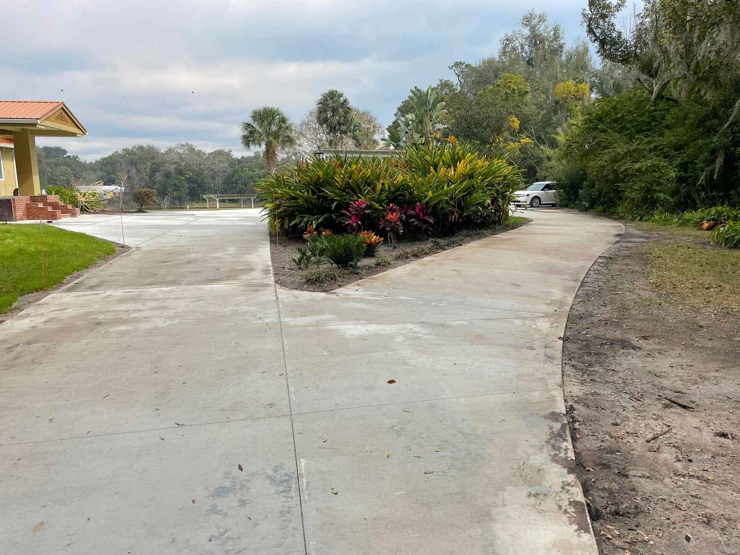 Long concrete driveway installation in DeLand Florida estate
